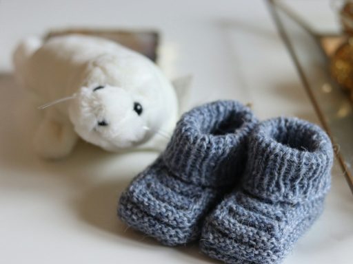 white bear plush toy on white table