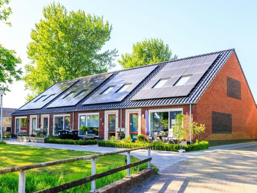 A house with a lot of solar panels on the roof